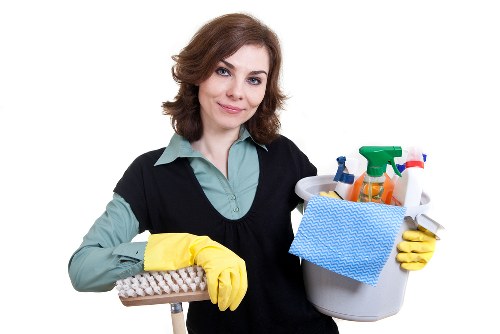 Local cleaners in Richmond vacuuming a home hallway